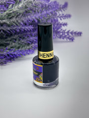 A bottle of Queen Nail Henna in Deep Lavender (Lilac) color with a black cap, placed against a white background with lavender flowers in the background. Sold by Amarya Henna