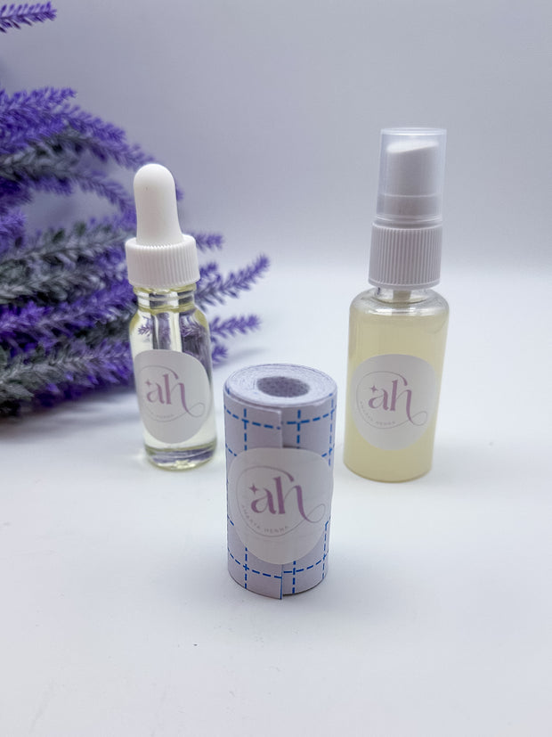 This image displays the Amarya Henna aftercare kit, which includes a clear lemon sugar sealant spray bottle, a roll of Mefix medical tape, and a small bottle of aftercare oil.