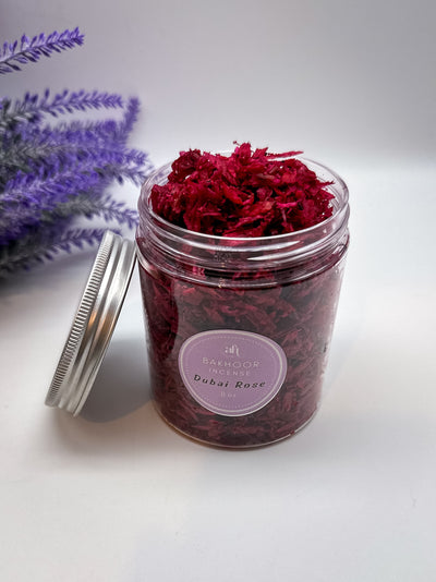 Handcrafted bakhoor incense by Amarya Henna, shown in packaging. Available in Dubai Rose, Cous Cous, and Halut scents, in 4oz and 8oz sizes.