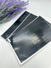 A strip of black pre-cut line tape for intricate designs by Amarya Henna 