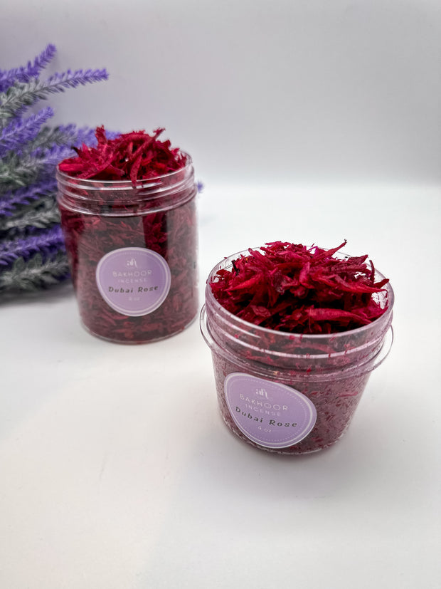 Handcrafted bakhoor incense by Amarya Henna, shown in packaging. Available in Dubai Rose, Cous Cous, and Halut scents, in 4oz and 8oz sizes.