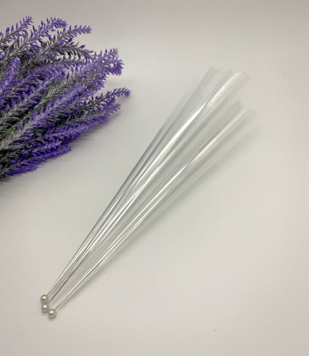 Rolled empty Cello Cones with a pin to keep them fresh and ready for intricate or bold designs by AmaryaHenna