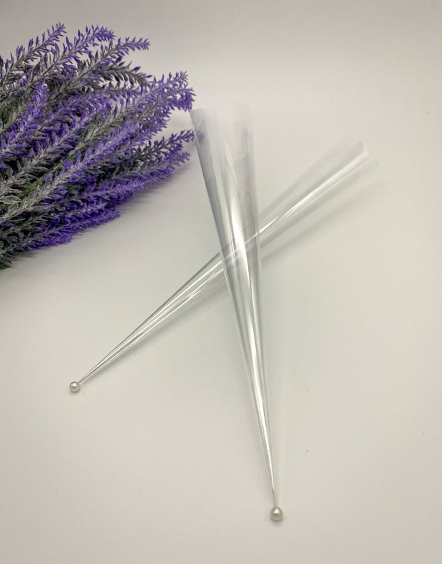 Rolled empty Cello Cones with a pin to keep them fresh and ready for intricate or bold designs by AmaryaHenna