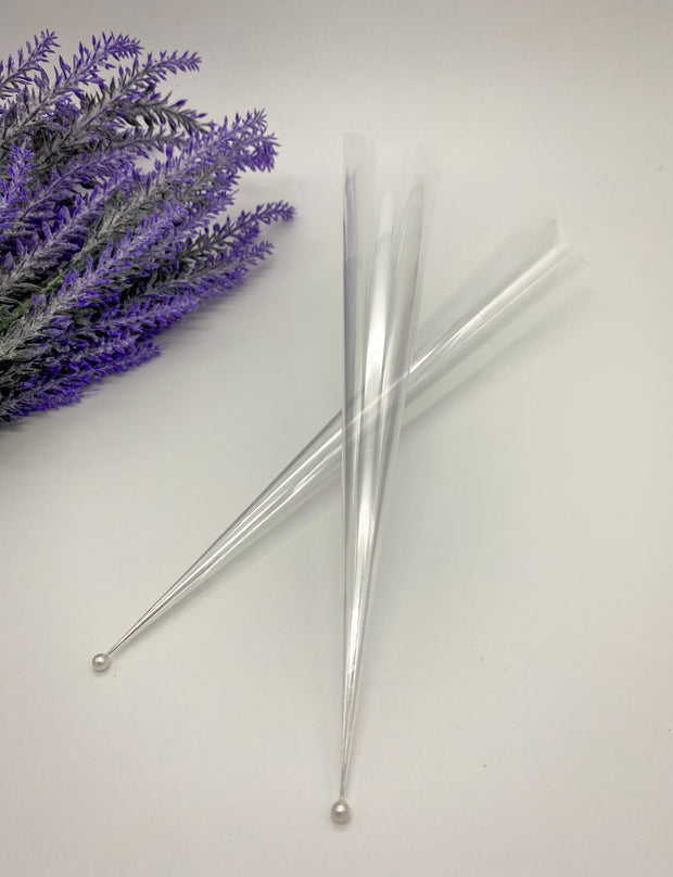 Rolled empty Cello Cones with a pin to keep them fresh and ready for intricate or bold designs by AmaryaHenna