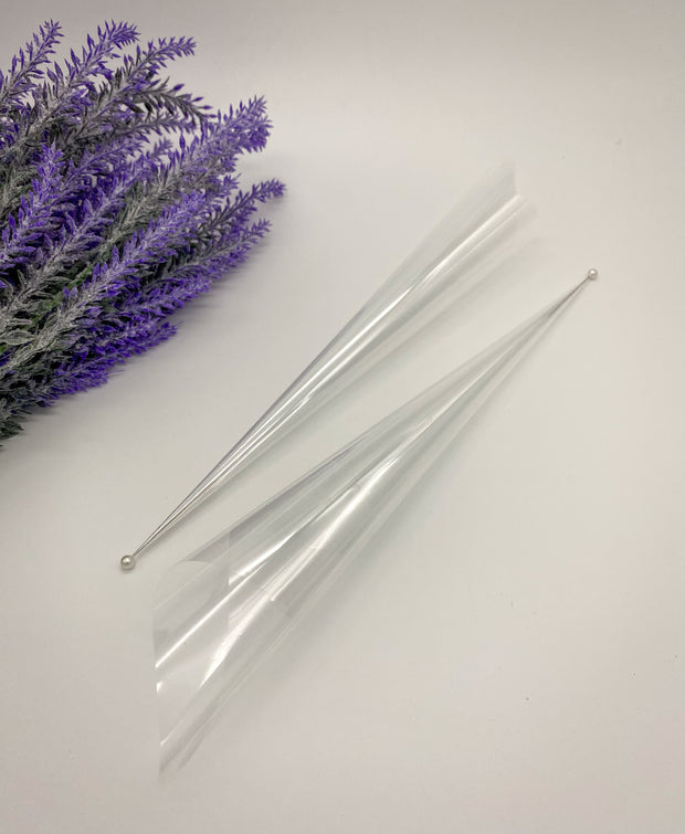Rolled empty Cello Cones with a pin to keep them fresh and ready for intricate or bold designs by AmaryaHenna